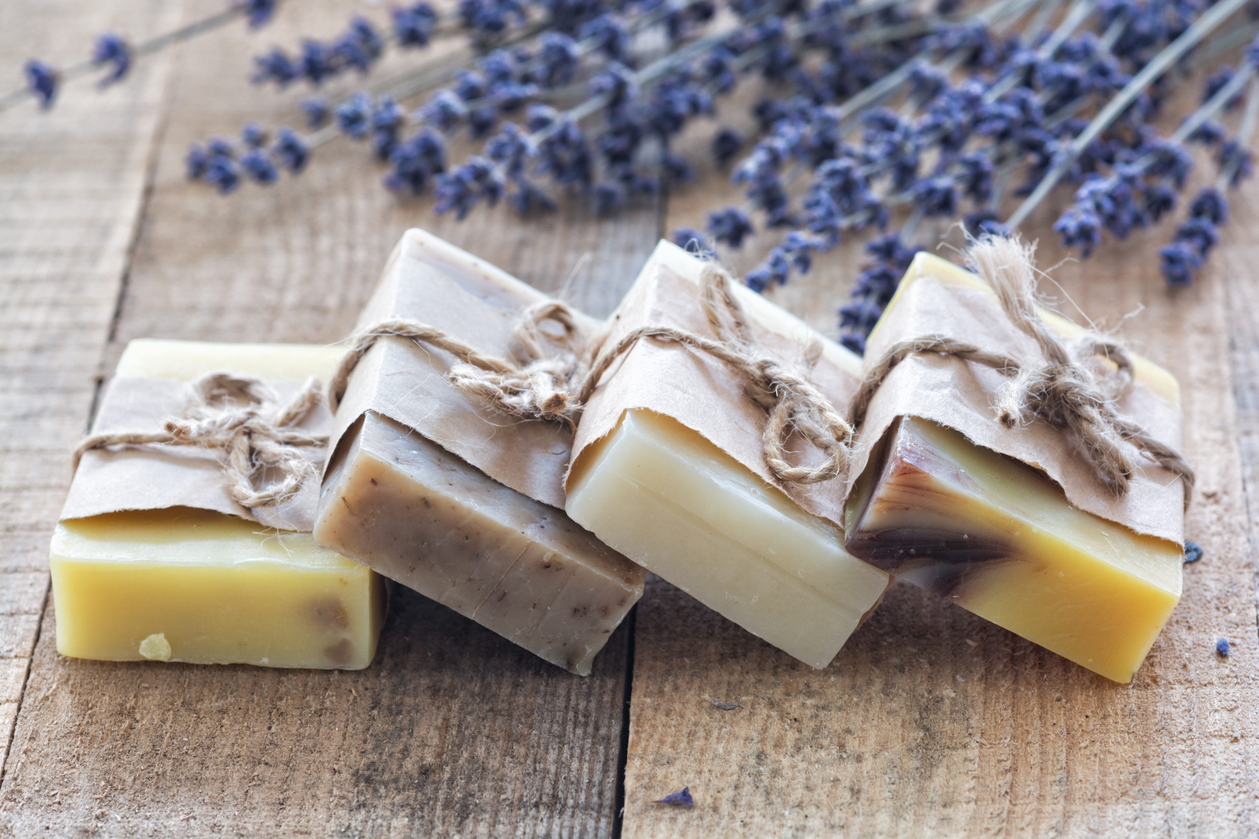 Handcrafted soap bars displayed on a wooden tray